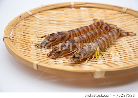 Nagasaki prawns on a colander 73257558