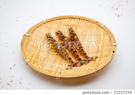 Nagasaki prawns on a colander 73257559