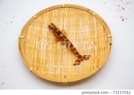 Nagasaki prawns on a colander 73257562