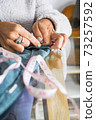 Close up of woman caucasian hands working like tailor at home - home work job activity for independent modern people 73257592