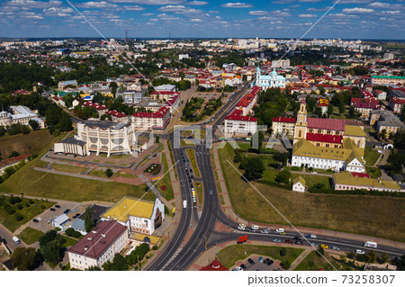 Top view of the city center of Grodno, Belarus. The historic center of the city with a red tile roof and an old Catholic Church Top view of the city center of Grodno, Belarus. The historic center of the city with a red tile roof and an old Catholic Church 73258307