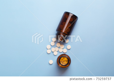 Medicine white pills and glass pills of bottles Medicine white pills and glass pills of bottles 73259737