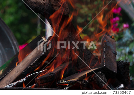 the fire quickly covers the logs on the fire 73260407
