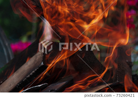 inflames the fire more covering firewood 73260421