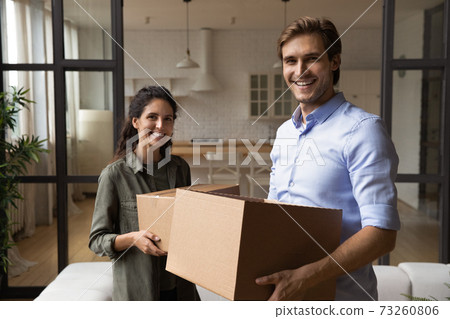 Portrait of smiling couple renters relocate to new home 73260806