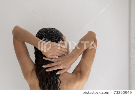 Back view of woman take shower in morning 73260949
