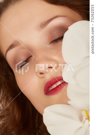 face with orchids face with orchids 73262055