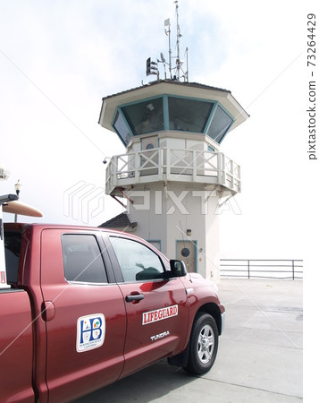 Vertical image of Huntington Beach rescue squad pickup truck taken from Pier's watchtower Vertical image of Huntington Beach rescue squad pickup truck taken from Pier's watchtower 73264429