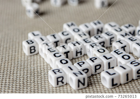 set of popular crypto coins words forming thematical crossword made of white cubes with black capital letters 73265013