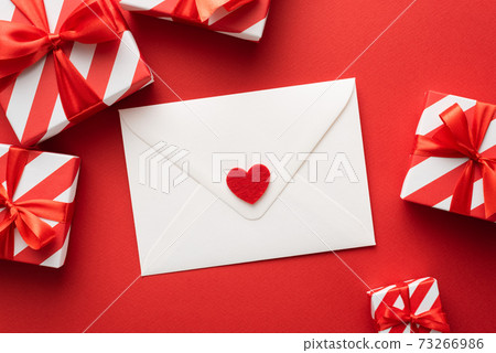 Valentine's day greeting card with gift boxes in red colors 73266986