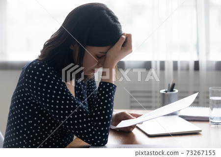 Unhappy korean female student read exams failure notice. Unhappy korean female student read exams failure notice. 73267155