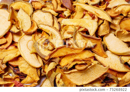 Dried apples background. chopped dried apples. natural background. Dried fruits concept of crop preservation, harvesting. Dried apples background. chopped dried apples. natural background. Dried fruits concept of crop preservation, harvesting. 73268922