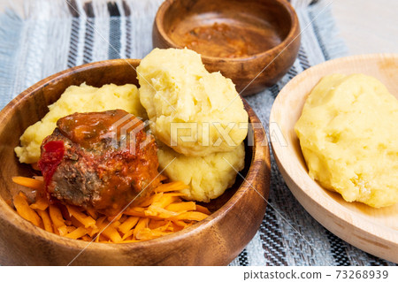 Ugly and sukuma wiki, maize flour porridge with meat and sweet potatoes, Zambian cuisine, Traditional African dishes Ugly and sukuma wiki, maize flour porridge with meat and sweet potatoes, Zambian cuisine, Traditional African dishes 73268939
