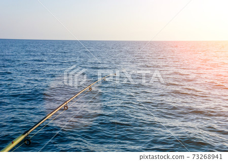fishing on sea before sunset. fishing selective focus. copyspace fishing on sea before sunset. fishing selective focus. copyspace 73268941