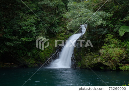 Materia waterfall flowing through the forest 73269000