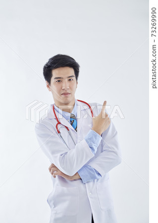handsome young doctor man on white background handsome young doctor man on white background 73269990
