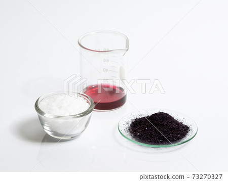 Cosmetic chemicals ingredient on white laboratory table. Potassium Permanganate Liquid, KMnO4, Microcrystalline wax. Cosmetic chemicals ingredient on white laboratory table. Potassium Permanganate Liquid, KMnO4, Microcrystalline wax. 73270327