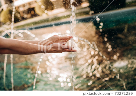 hands lovers splashing fountain playing water summer 73271289