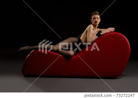 Topless Woman in Red Tights Stock Photo