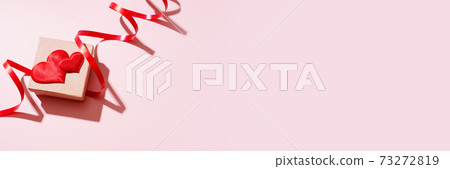 Valentines day festive banner with gift box decorated with red hearts and ribbon Valentines day festive banner with gift box decorated with red hearts and ribbon 73272819