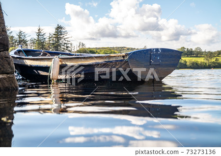 Rowing boat at the pier in Bruckless in County Donegal - Ireland. Rowing boat at the pier in Bruckless in County Donegal - Ireland. 73273136