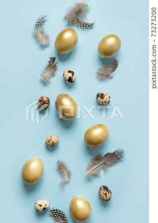 Easter vertical greeting card with golden eggs on blue background. Easter vertical greeting card with golden eggs on blue background. 73273200