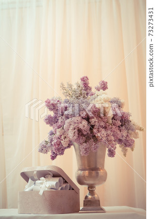 Lilac bouquet in a silver vase Lilac bouquet in a silver vase 73273431