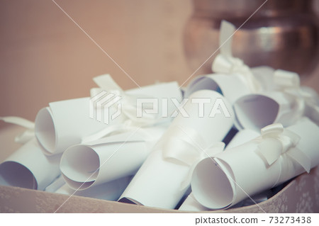 Creative invitations are roll up in the scrolls. Creative invitations are roll up in the scrolls. 73273438