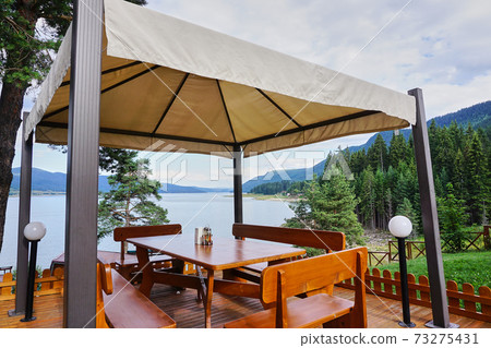 Relaxing pergola with wonderful landscape view Relaxing pergola with wonderful landscape view 73275431