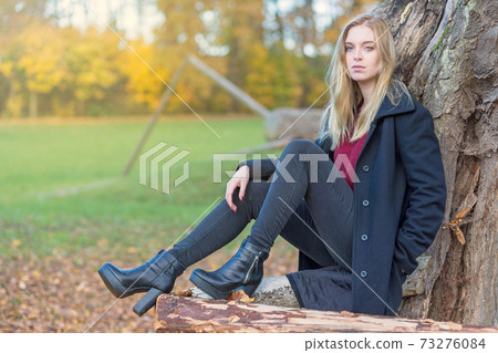 Portrait of young girl in autumn park Portrait of young girl in autumn park 73276084