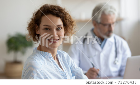 Head shot portrait of smiling beautiful young woman visiting doctor. Head shot portrait of smiling beautiful young woman visiting doctor. 73276433