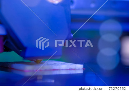 Three dimensional printing machine prints physical 3D model - close up Three dimensional printing machine prints physical 3D model - close up 73279262