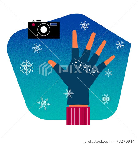 Hand in fingerless gloves, camera, snowflakes - photography in winter 73279914
