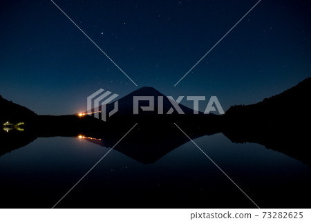 Upside-down Mt. Fuji reflected in Lake Shoji and stars reflected on the surface of the lake Upside-down Mt. Fuji reflected in Lake Shoji and stars reflected on the surface of the lake 73282625