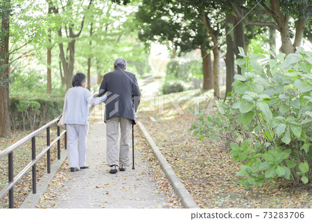 Senior couple taking a walk Senior couple taking a walk 73283706