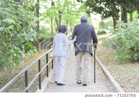 Senior couple taking a walk Senior couple taking a walk 73283708