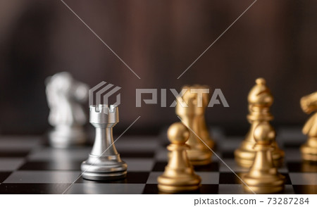 Silver and gold chess on the board Silver and gold chess on the board 73287284