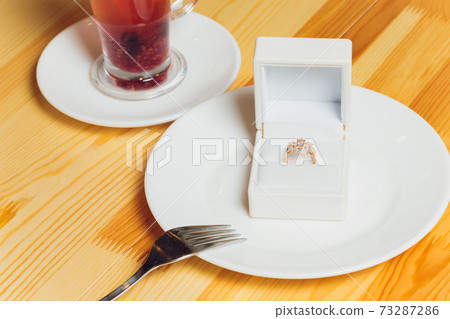 Beautiful new pair of elegant white gold wedding rings and white gold engagement ring, white square ring box. 73287286