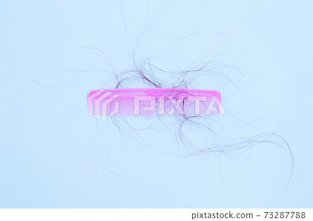 Hairs loss fall in comb on white background. Hairs loss fall in comb on white background. 73287788