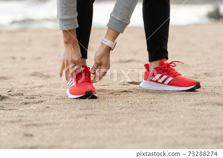 Scene of tying shoelaces in preparation Scene of tying shoelaces in preparation 73288274