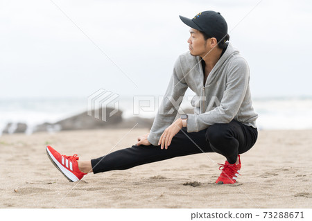 Men stretching in nature Men stretching in nature 73288671