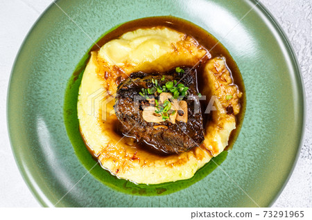 Beef tenderloin steak with mashed potatoes. White background. Top view 73291965