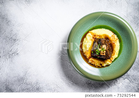 Beef tenderloin steak with mashed potatoes. White background. Top view. Copy space 73292544