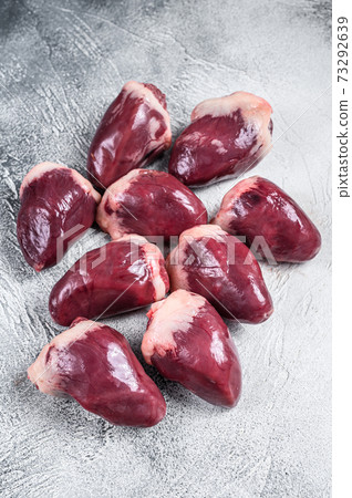 Raw turkey hearts offal. White background. Top view 73292639