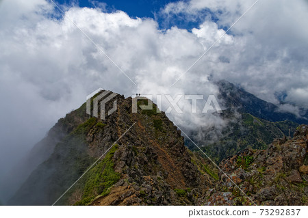Cloud-spring Ryutomine and climbers seen from Yatsugatake mountain range and Akadake Cloud-spring Ryutomine and climbers seen from Yatsugatake mountain range and Akadake 73292837
