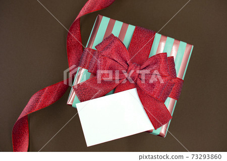 Gift wrapped with red ribbon, valentine image 73293860