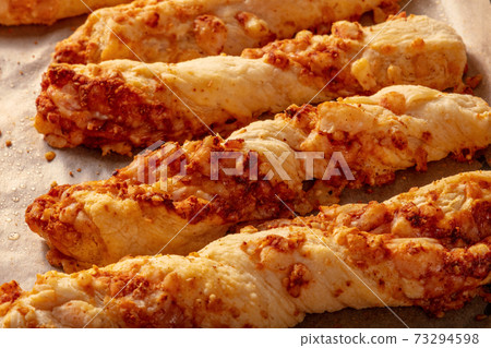 Homemade cheese straws on a baking tray Homemade cheese straws on a baking tray 73294598