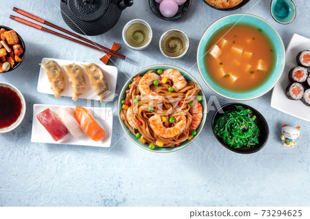 Japanese food with a place for text. Sushi, miso soup, udon, tea etc Japanese food with a place for text. Sushi, miso soup, udon, tea etc 73294625