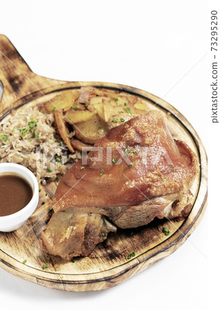 SCHWEINSHAXE traditional german pork knuckle with sauerkraut and potatoes meal SCHWEINSHAXE traditional german pork knuckle with sauerkraut and potatoes meal 73295290