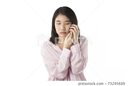 young asian woman holding mobile feel sleepy young asian woman holding mobile feel sleepy 73295689